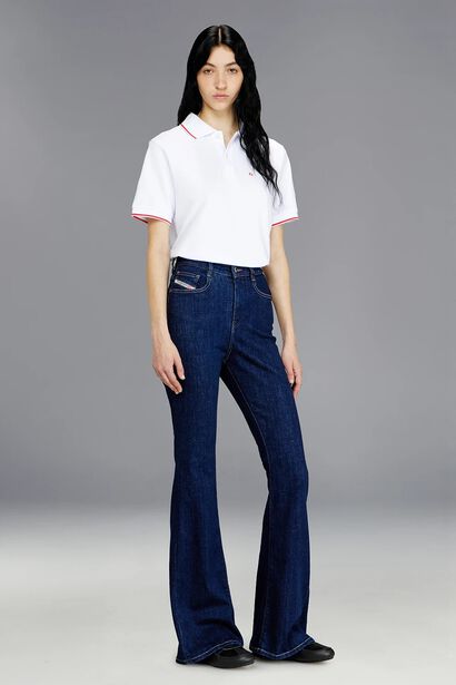 Model wearing the D-Partt bootcut fit jeans. Diesel&rsquo;s take on the all-American classic Bootcut. The high-waisted fit has an extra-long, slim leg with an ample flare to create an ultra-elongated silhouette.